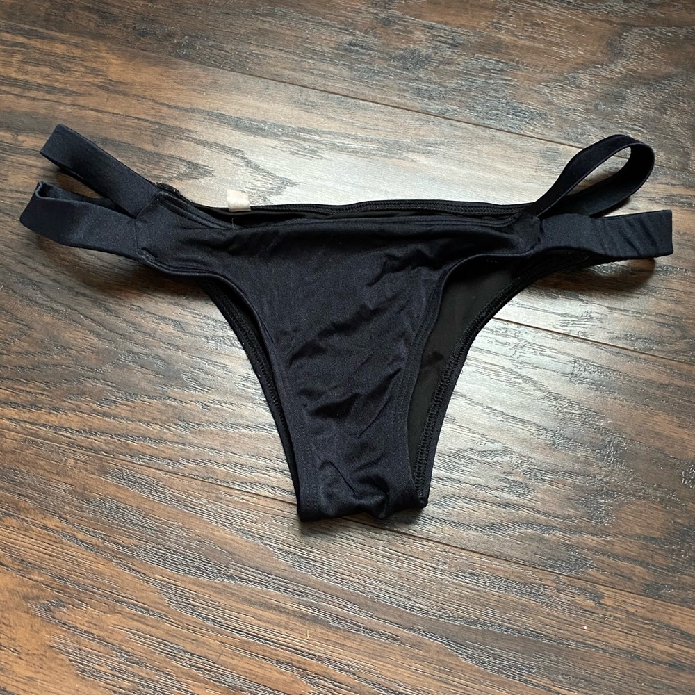 Black side cut swimsuit bottoms
